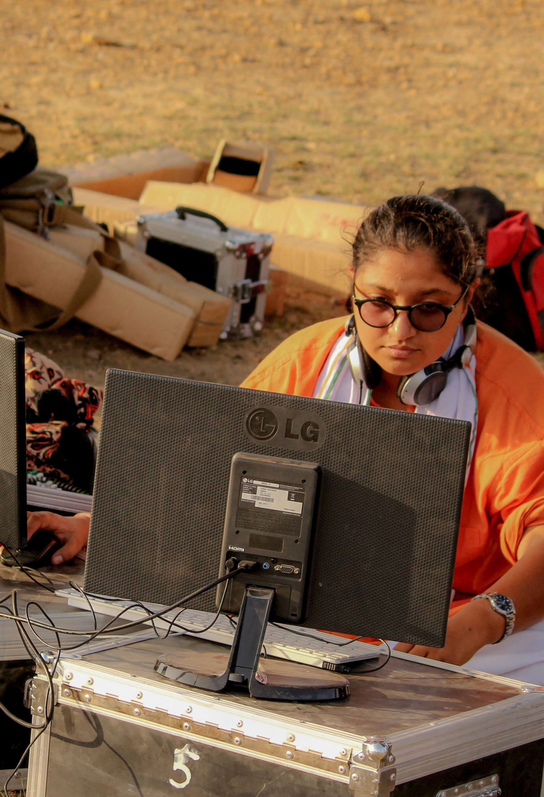 Ayesha Vasdev at the editing monitor on location