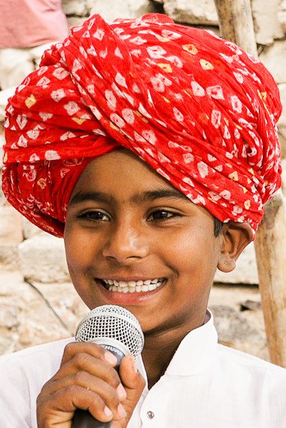 A young performer with a microphone