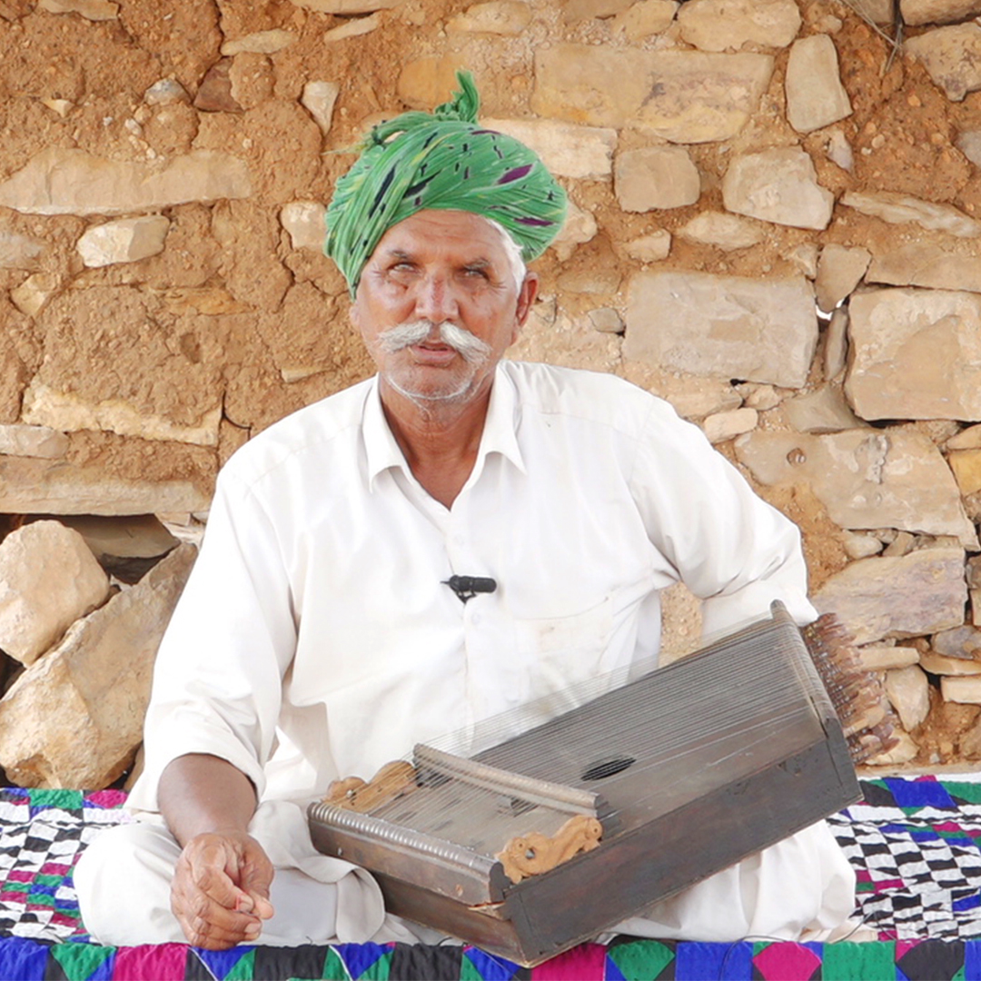 Chanan Khan playing the surmandal
