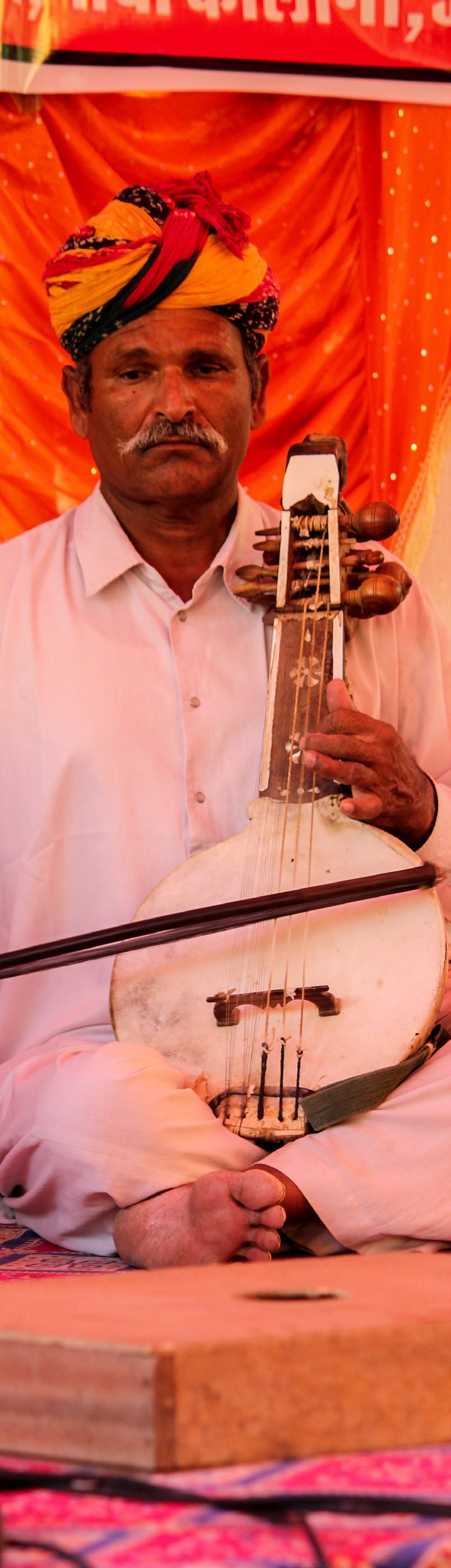 Musician tuning his instrument before a performance